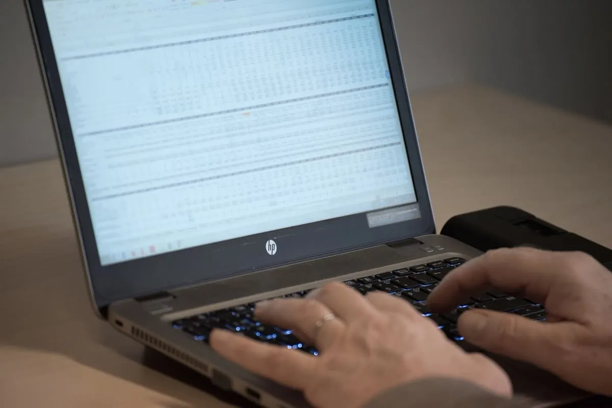A person reviewing financial planning documents at a desk, representing the runway calculation a career change requires
