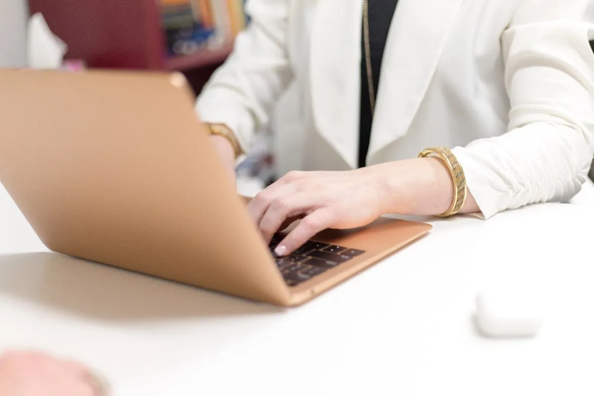 A professional reviewing career options while working at a laptop